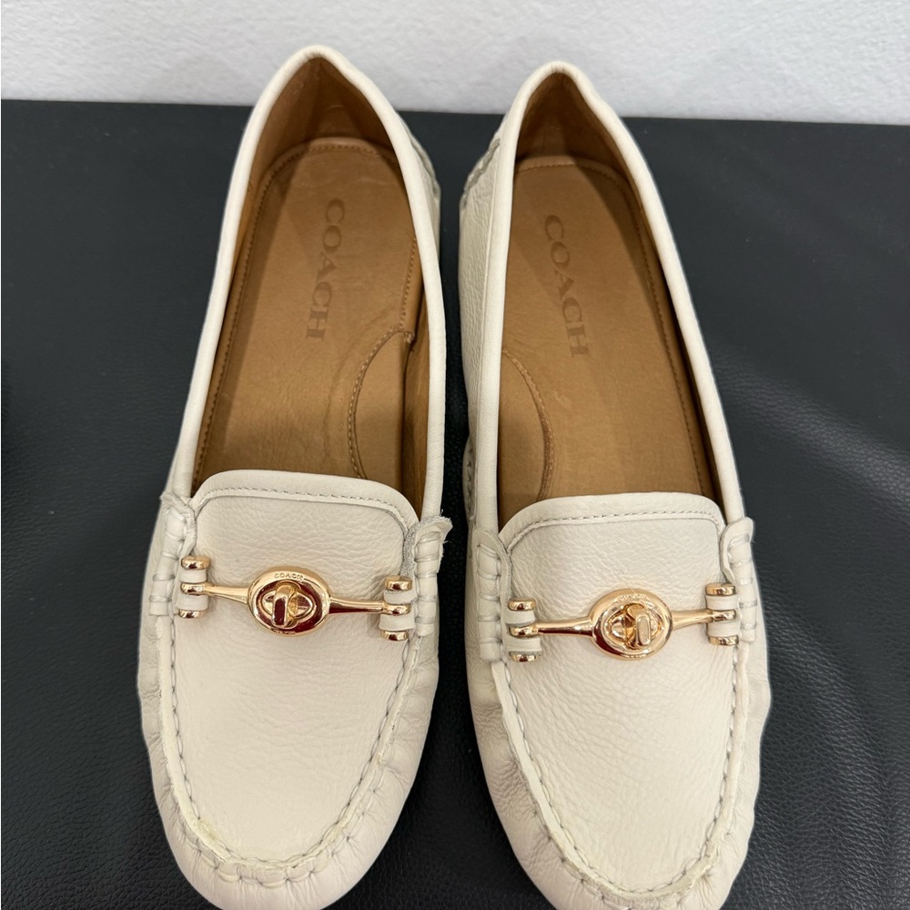 Coach Cream Flats with Decorative Stitching and Metallic Accents